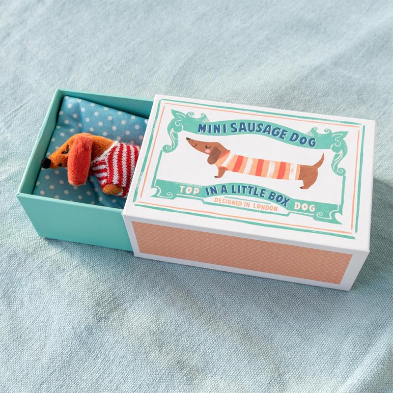 mini sausage dog plush toy in a little box