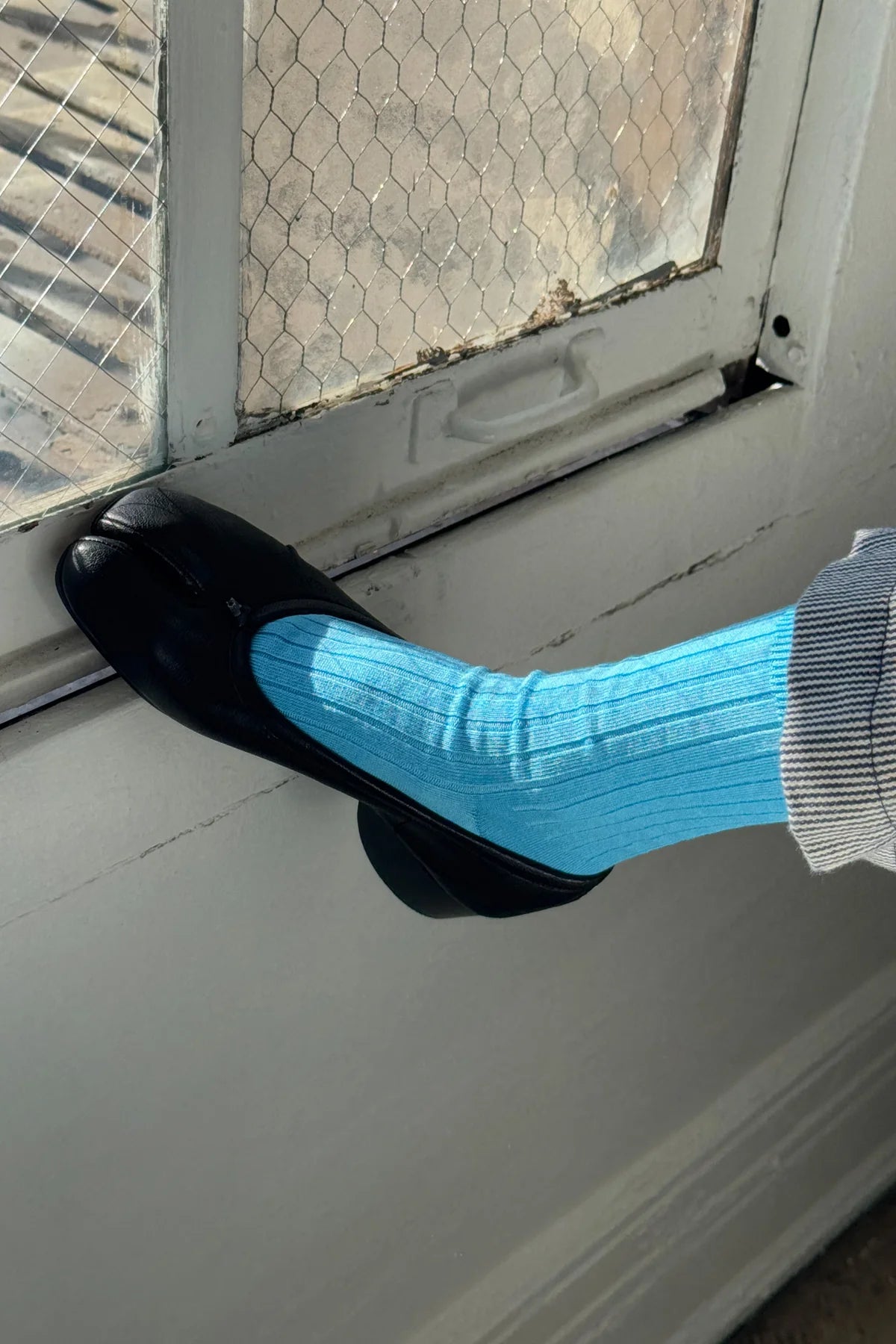 Her blue water socks