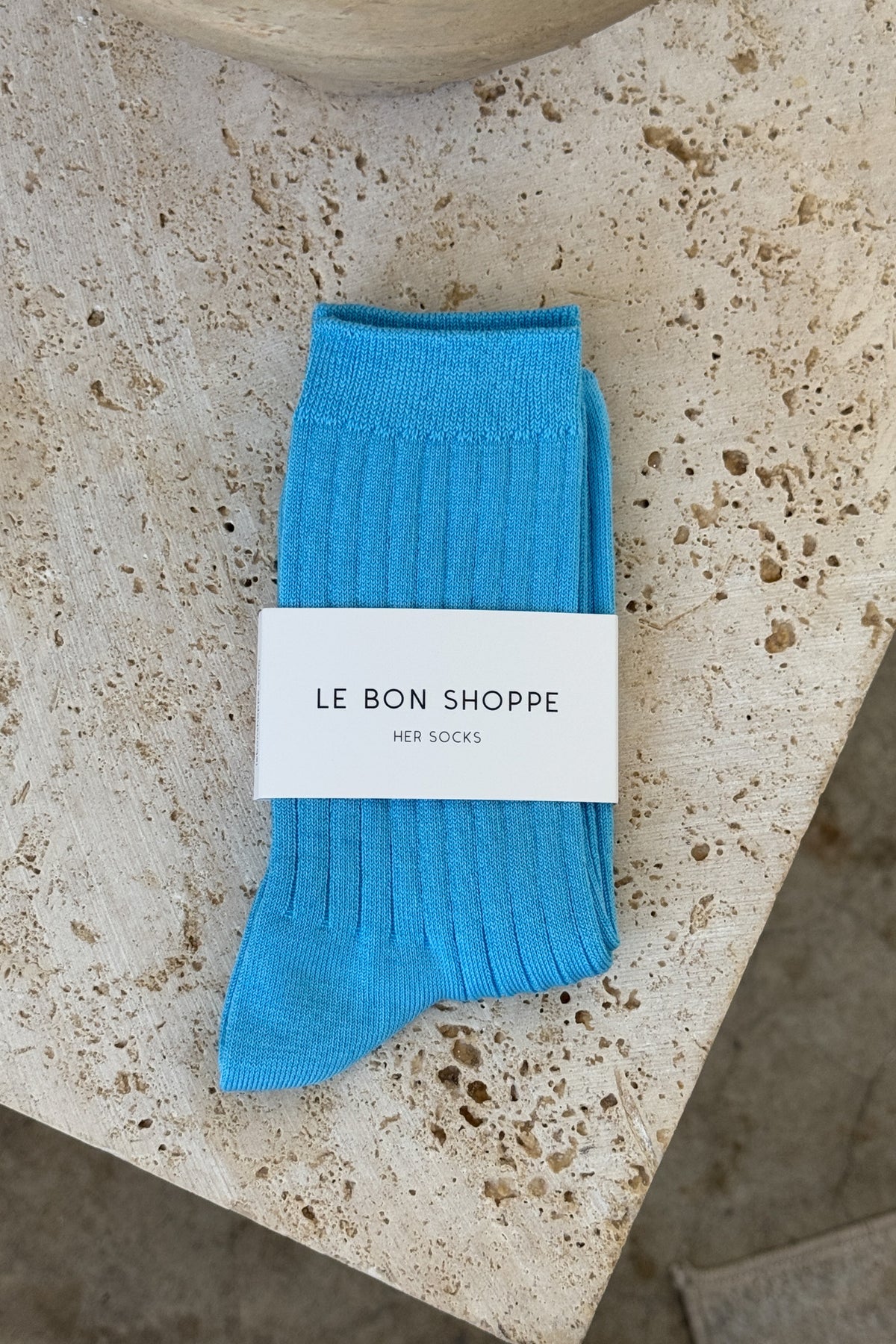 Her blue water socks