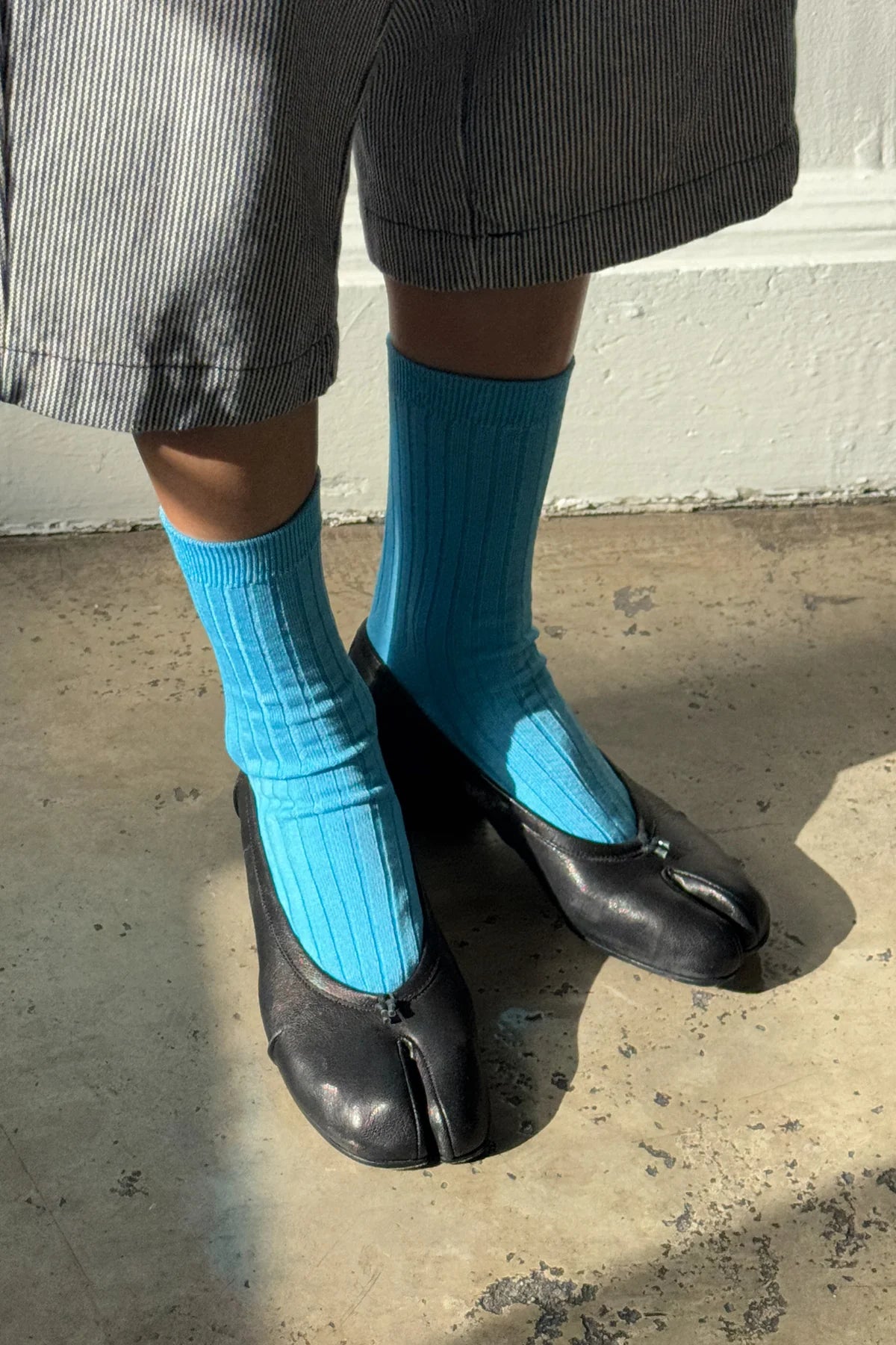 Her blue water socks