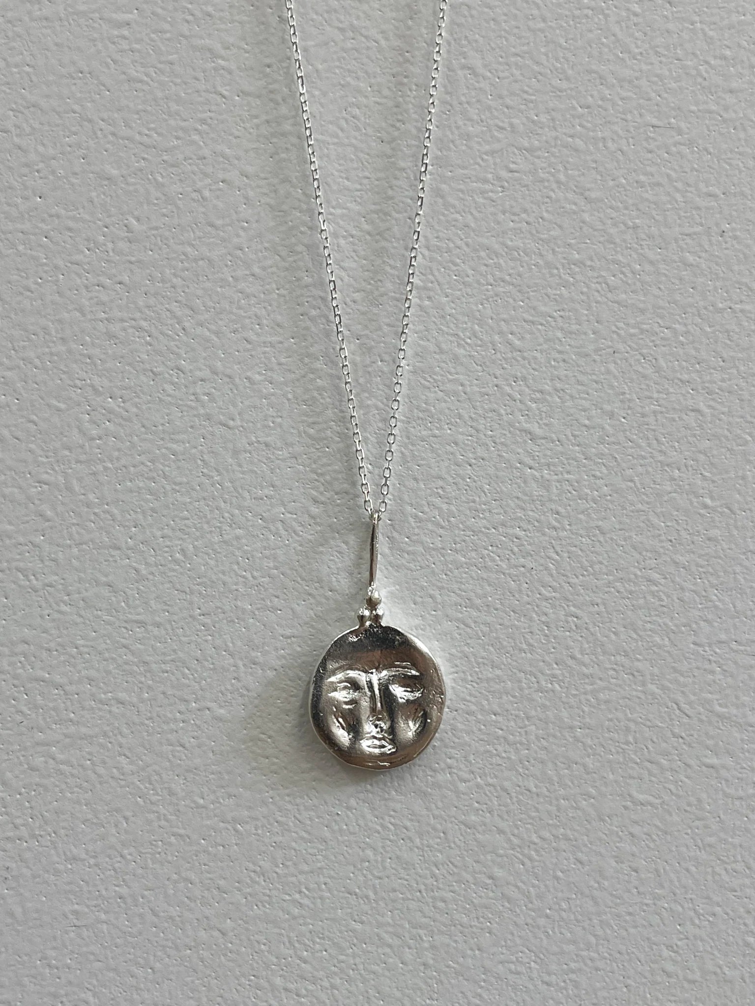 Moon Face amulet silver